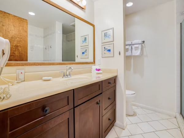 Luxury Poipu Kauai Vacation Rental  Ocean View Top-Floor Condo Near Brennecke’s Beach